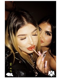 two women posing for a photo at a party