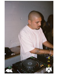 a man is djing at a party